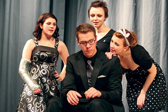 Group Performance Art (GPA) members Beth Good, Jessi Archambeau, and Savannah Carpenter gather around their cast mate Wyatt Kimbrough during their performance on January 9, 2015 in the East High Performance Hall. GPA is an original piece that is written by the cast who performs it.
