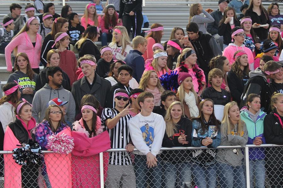 Led by their own referee, the T-Birds proudly sport pink in support of breast cancer awareness at the Evanston football game on October 15.