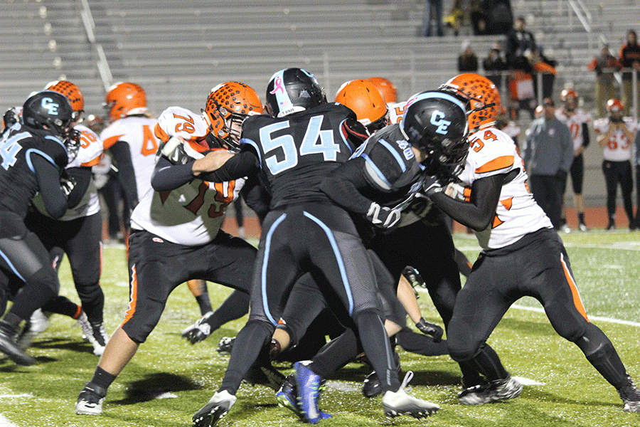 Sophomore Jake Fogg, #54, corrals the Rock Springs running back. Jake blocked a Tiger extra point kick to help seal the T-Bird win.