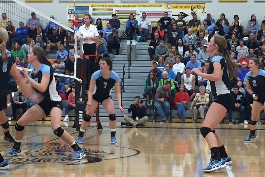 Cosette Stellern, #7, and her team prepare to return a serve in the championship regional game. The T-Birds swept the Camels.