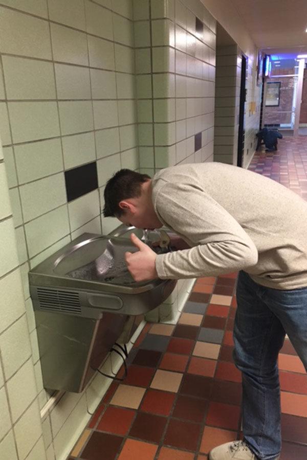 Sophomore Camden Schmidt drinks out of the number 1 ranked water fountain in East, the Tbird Nest Hallway Fountain.  