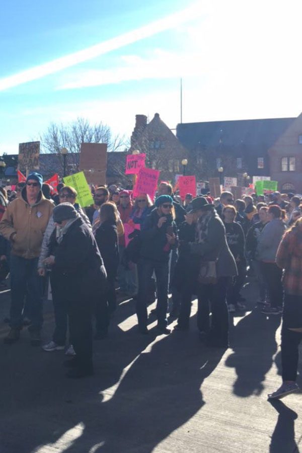 A portion of the marchers meet in front of the depot with their signs ready to march to the Capitol.