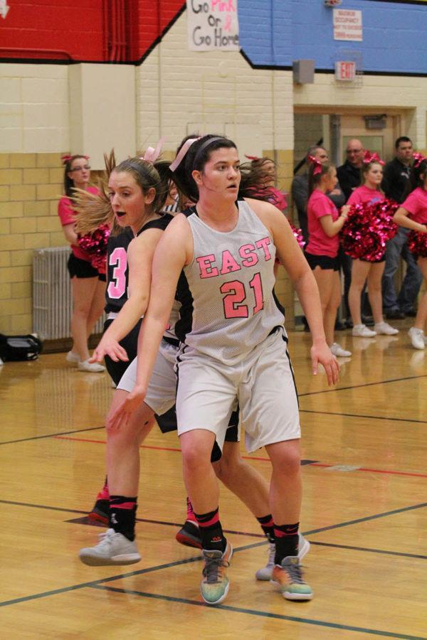 Katie Loken and Cosette Stellern practice their guarding before the game