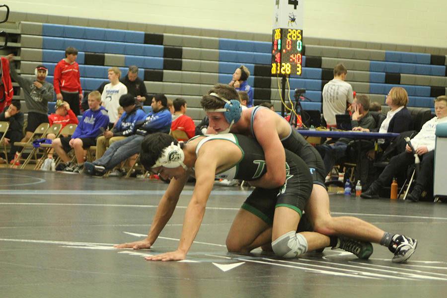 Seth Green pins his opponent to the matt at Charlie Lake later leading to a number one victory at Ron Thon