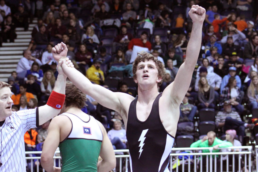 Senior Seth Green raises his fists in victory at state wrestling in Casper.