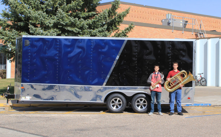 Colby Thyarks and Joel Bridenstine pose with the new and improved EHS band trailer