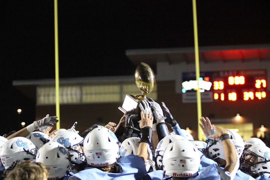The Varsity football team celebrates their win against cross town rival, Central, winning the Capital City Bowl.