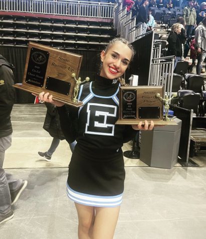 Alyssa Medina shows off the teams Runner Up and Fourth Place Dance trophies