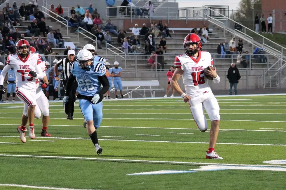 Number 16 is running down as Number 26 is chasing after him